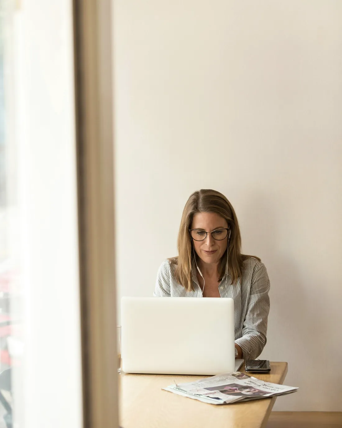A developer working on a laptop at a quiet desk